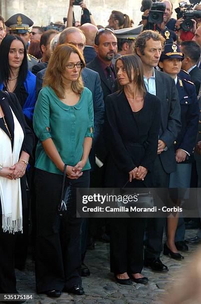 Italian opera tenor legend Luciano Pavarotti's wife Nicoletta Mantovani and his doughter Lorenza Pavarotti wait during his funeral outside the Dome...