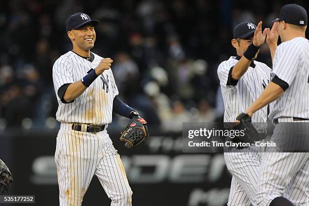 Derek Jeter, , congratulates Shawn Kelley, who closed the game for the New York Yankees during the New York Yankees V Baltimore Orioles home opening...