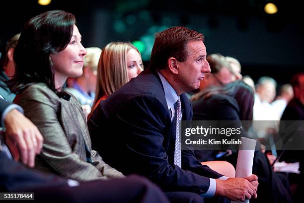 Safra Catz, left, and Mark Hurd, right, both co-presidents of Oracle Corp., listen to Larry Ellison, chief executive officer of Oracle Corp., speak...