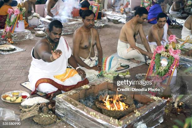 prayers pooja and havan performed by south indian men. - traditional ceremony stock pictures, royalty-free photos & images