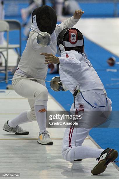 Tomonaga Natsumi from Japan and Kim Sunwoo from Korea compete in the fencing at the mixed relay World Championship in modern pentathlon in Olympic...