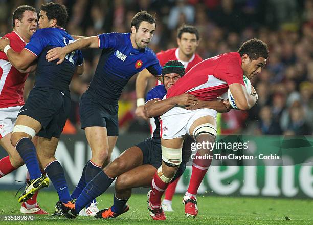 Toby Faletau, Wales, is tackled by Thierry Dusautoir, France, during the Wales V France Semi Final match at the IRB Rugby World Cup tournament, Eden...