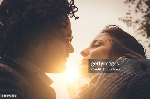 young couple in love kissing - sillouette cool attitude stock pictures, royalty-free photos & images