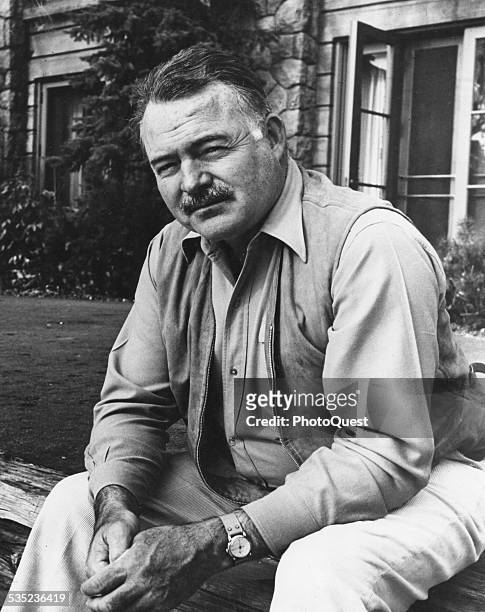 Ernest Hemingway , American novelist, journalist, and short story writer, mid 20th century.