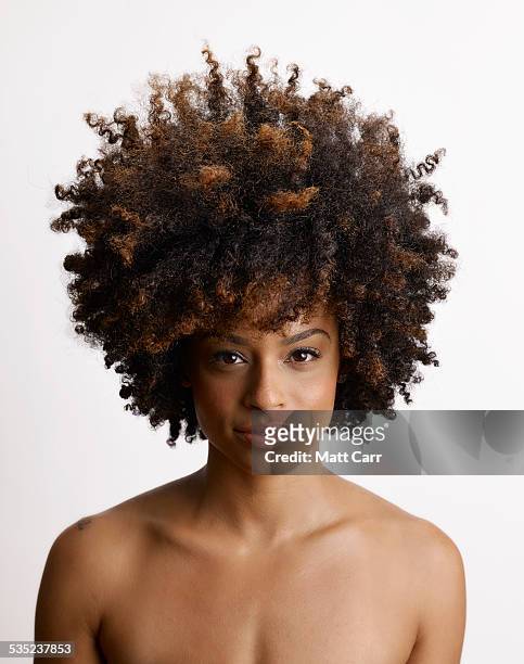 young woman with big hair - afro frisur stock-fotos und bilder