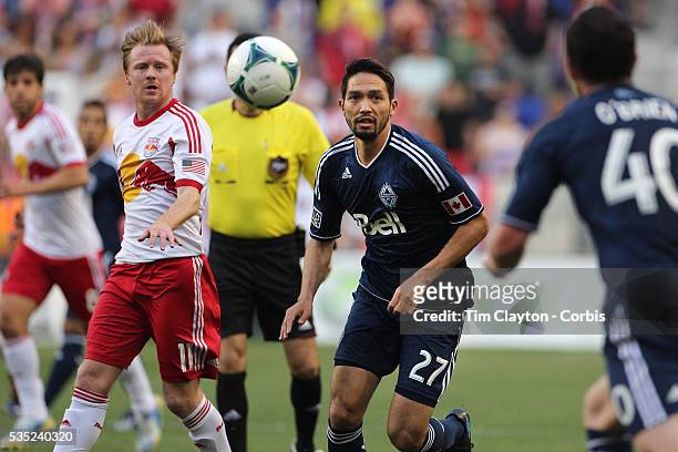 Jun Marques Davidson, Vancouver Whitecaps, is challenged by Dax McCarty, New York Red Bulls, during the New York Red Bulls V Vancouver Whitecaps FC,...