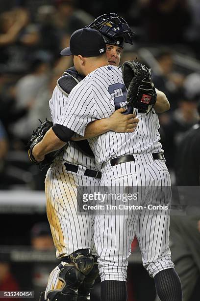 Catcher Brian McCann, , New York Yankees, congratulates Shawn Kelley, New York Yankees, after closing out the game in the ninth inning during the New...