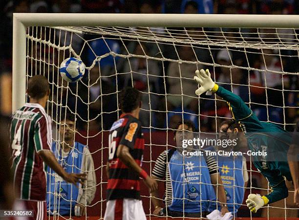 Fluminense goalkeeper Alberto Martín Da Silva is beaten by a free kick from Renato for Flamengo's third goal during the Flamengo V Fluminense,...