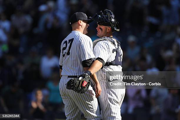 Shawn Kelley, , New York Yankees, is congratulated on the save in the ninth inning by catcher Brian McCann during the New York Yankees V Boston Red...