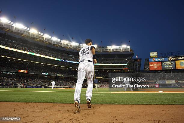 Derek Jeter, New York Yankees, heads out of the dugout wearing number 42 during Jackie Robisnon Day celebrations during the New York Yankees V...