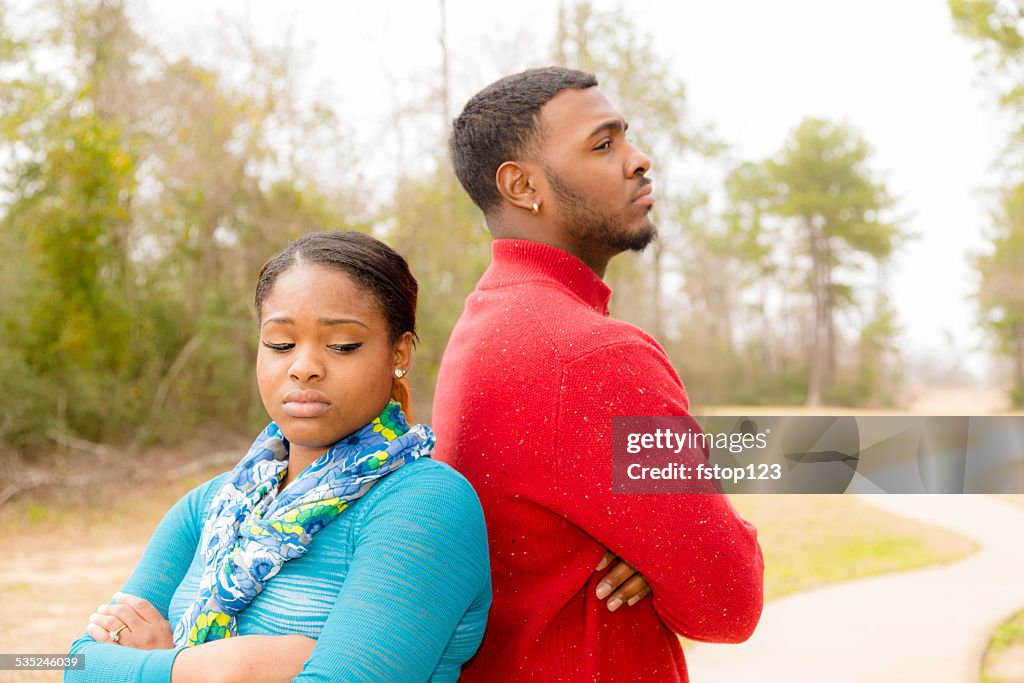 Conflict, arguement between African descent couple. Sadness, despair, anger.