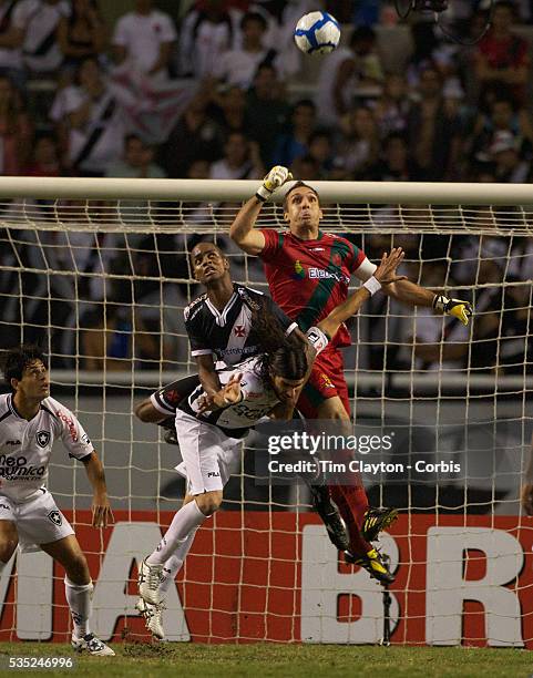 Vasco keeper Fernando punches clear from Botafogo striker Loco Abreu during the Botafogo V Vasco, Futebol Brasileirao League match at Estadio...