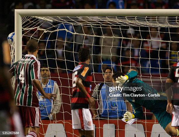 Fluminense goalkeeper Alberto Martín Da Silva is beaten by a free kick from Renato for Flamengo's third goal during the Flamengo V Fluminense,...