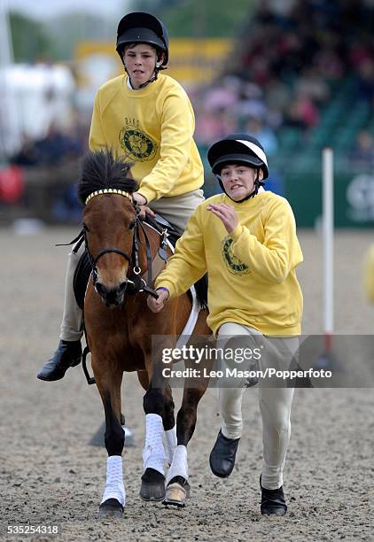 View of a horse and rider competing in the final of the DAKS Pony Club mounted games at the 2010 Royal Windsor Horse Show in Windsor Great Park,...