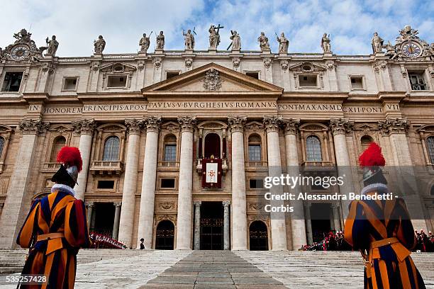 Swiss Guards patrol St. Peter's Square at the Vatican at the end of Pope Benedict XVI's "Urbi et Orbi" message. Questions regarding the enforcement...