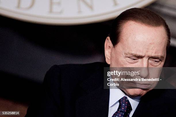 Italian Prime Minister Silvio Berlusconi grimaces during a meeting with Emir of Kuwait, Sheikh Sabah Al-Ahmad Al-Jaber at Villa Madama.