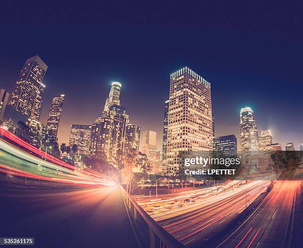 downtown los angeles long exposure photograph taken at twilight. - hollywood at night stock pictures, royalty-free photos & images