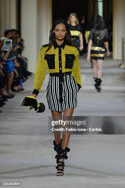 Model walks the runway during the Emanuel Ungaro fashion show at Paris Fashion Week Womenswear Spring/Summer 2014 on Septemner 30, 2013 in Paris,...