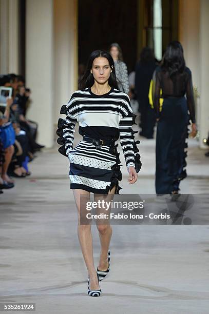 Model walks the runway during the Emanuel Ungaro fashion show at Paris Fashion Week Womenswear Spring/Summer 2014 on Septemner 30, 2013 in Paris,...