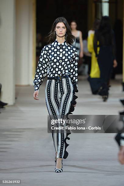 Model walks the runway during the Emanuel Ungaro fashion show at Paris Fashion Week Womenswear Spring/Summer 2014 on Septemner 30, 2013 in Paris,...