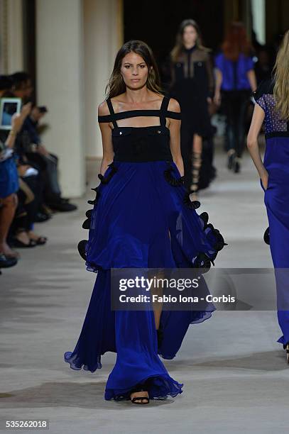 Model walks the runway during the Emanuel Ungaro fashion show at Paris Fashion Week Womenswear Spring/Summer 2014 on Septemner 30, 2013 in Paris,...