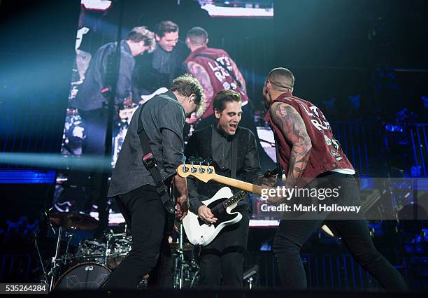 James Bourne and Charlie Simpson and Matt Willis of Busted performing during the Pigs Can Fly tour at BIC on May 25, 2016 in Bournemouth, England.