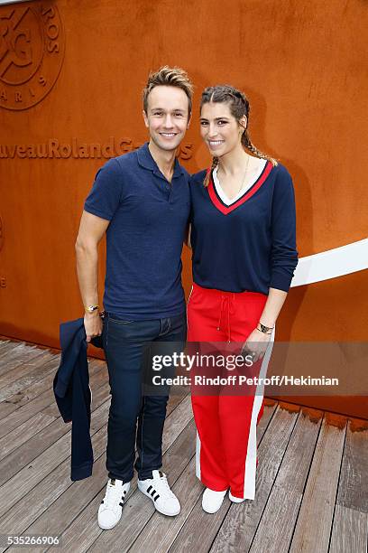 Cyril Feraud and Laury Thilleman attend the French Tennis Open Day 8 at Roland Garros on May 29, 2016 in Paris, France.