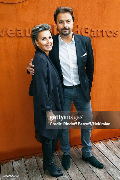 Henri Leconte and Maria Dowlatshahi attend the French Tennis Open Day 8 at Roland Garros on May 29, 2016 in Paris, France.