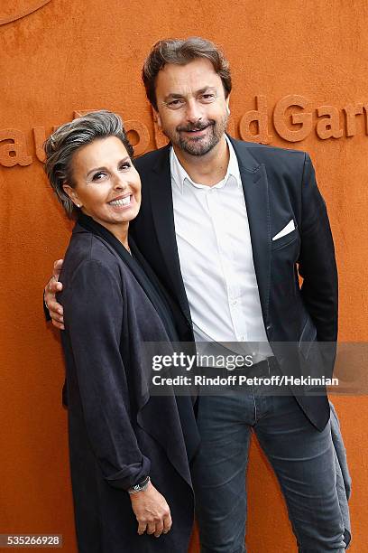 Henri Leconte and Maria Dowlatshahi attend the French Tennis Open Day 8 at Roland Garros on May 29, 2016 in Paris, France.