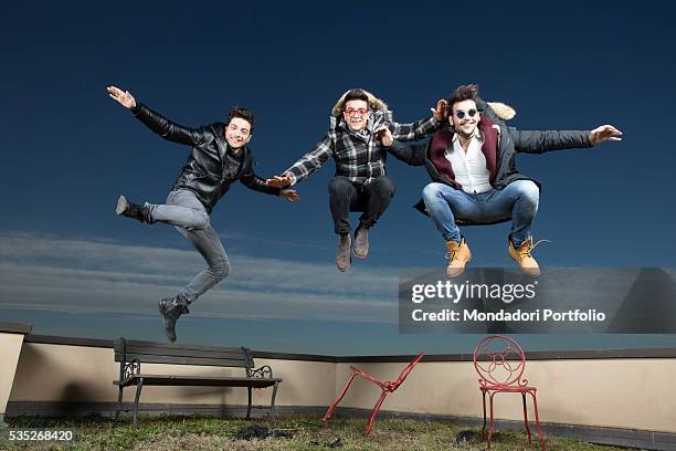 The singers and members of the band Il Volo Piero Barone, Ignazio Boschetto and Gianluca Ginoble jumping up on a terrace. Bologna, Italy. 11th...