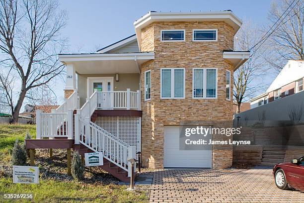 S near zero energy home in Patterson, New Jersey. This demonstration home uses 80% less energy than the average American home. It has innovations...
