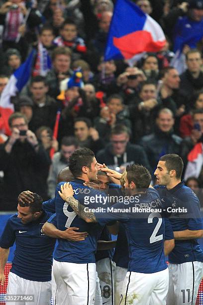 Loic Remy of France celebrates with team mates after scoring a goal during the International Friendly match between France and USA at Stade de France...