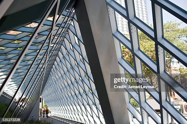 People enter a passageway in The Seattle Central Library, which was designed by the Dutch Architect Rem Koolhaas. It is the flagship library of the...