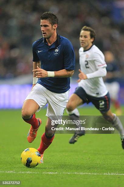 Olivier Giroud of France runs with the ball during the International Friendly match between France and USA at Stade de France on November 11, 2011 in...