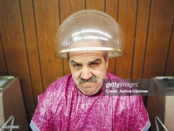 man with angry expression - vintage beauty salon stock-fotos und bilder