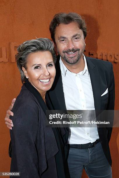 Henri Leconte and Maria Dowlatshahi attend Day Height of the 2016 French Tennis Open at Roland Garros on May 29, 2016 in Paris, France.