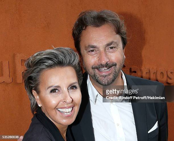 Henri Leconte and Maria Dowlatshahi attend Day Height of the 2016 French Tennis Open at Roland Garros on May 29, 2016 in Paris, France.