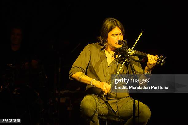 Singer-songwriter and multi-instrumentalist Cristiano De André performing during a concert playing the violin. Italy, 2015