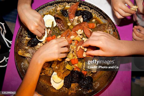 eat tajine with quince and beef - kid boiled egg stock pictures, royalty-free photos & images