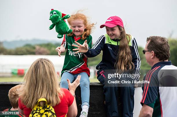 Gaelic football fans and Mayo supporters Clionr Rafter and Aine Rafter play catch with a team mascot toy with their parents as Prime Minister of...