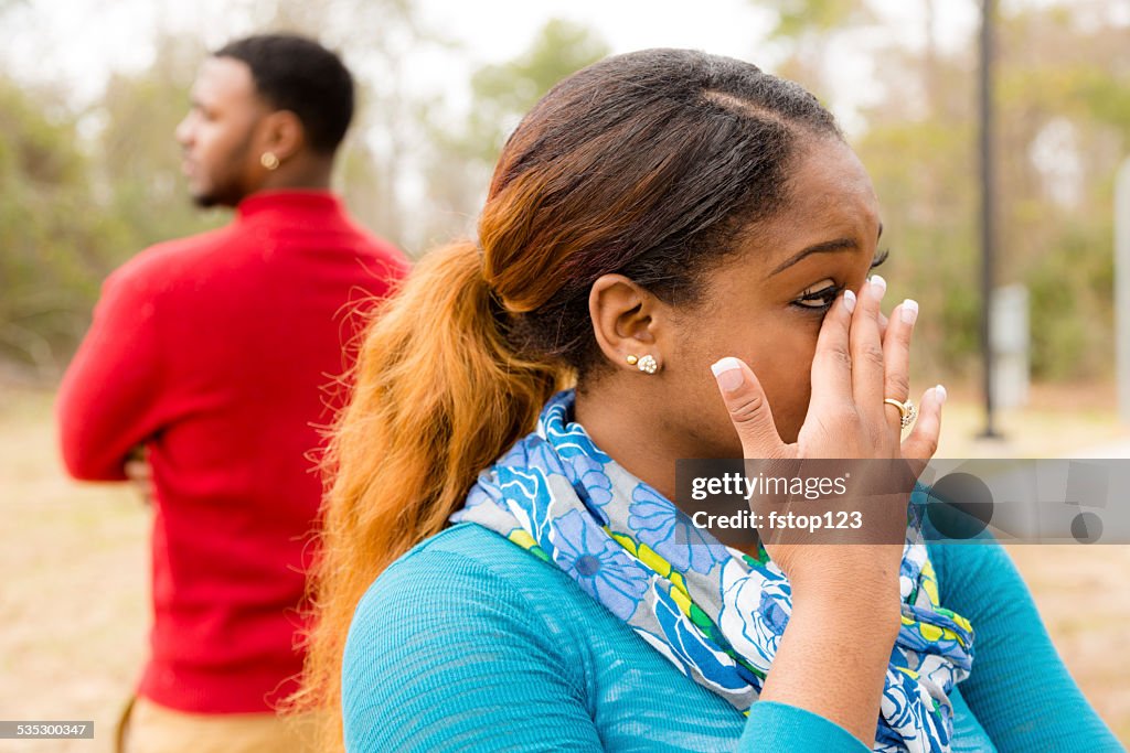 Conflict, arguement between African descent couple. Sadness, crying, anger.