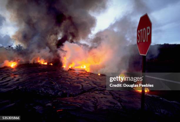 lava spreading over road - big island volcano national park stock pictures, royalty-free photos & images