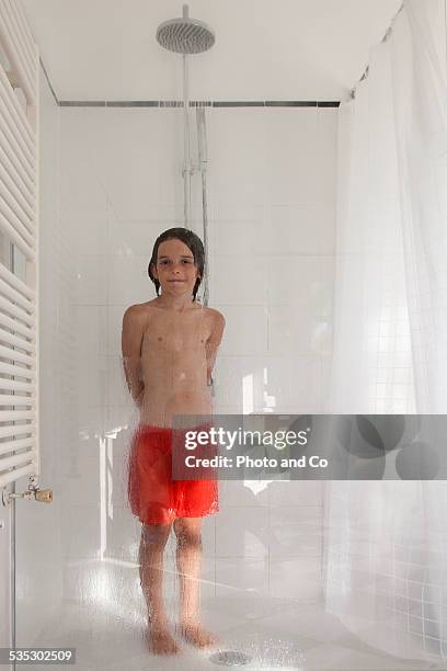 child in the shower - boys taking a shower stock pictures, royalty-free photos & images