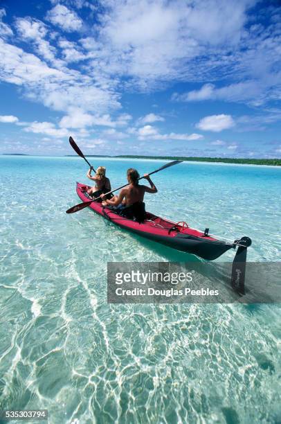 kayaking in clear tropical water - aitutaki bildbanksfoton och bilder