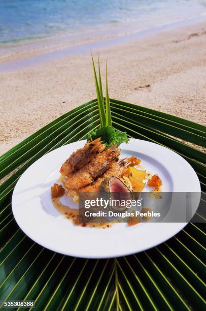 seafood dish on tropical beach - pacific_plate stock pictures, royalty-free photos & images