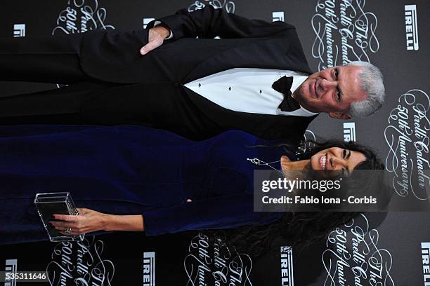 Marco Tronchetti Provera and Afef Jenin attend the Pirelli Calendar 50th Anniversary event on November 21, 2013 in Milan, Italy