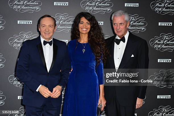 Kevin Spacey, Afef Jenin and Marco Tronchetti Provera attend the Pirelli Calendar 50th Anniversary event on November 21, 2013 in Milan, Italy