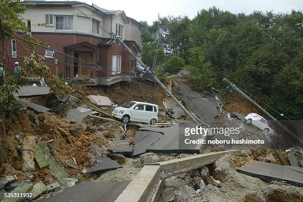 Houses collapsed and roads were destroyed in Ojiya City, Niigata-Prefecture in Japan after an earthquake, the first and biggest tremor measuring a...