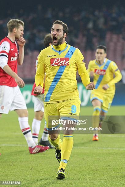 Gonzalo Iguain of Napoli celebrates after scoring the opening goal the UEFA Champions League Group F match between SSC Napoli and Arsenal at Stadio...