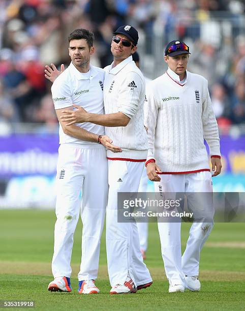 James Anderson of England celebrates with England captain Alastair Cook after dismissing Angelo Mathews of Sri Lanka during day three of the 2nd...